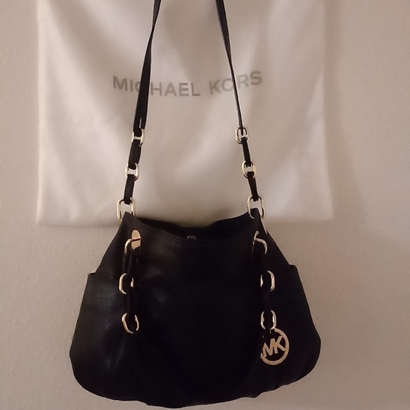 Michael Kors Handbags - Micheal Kors Black/Gold Leather bag